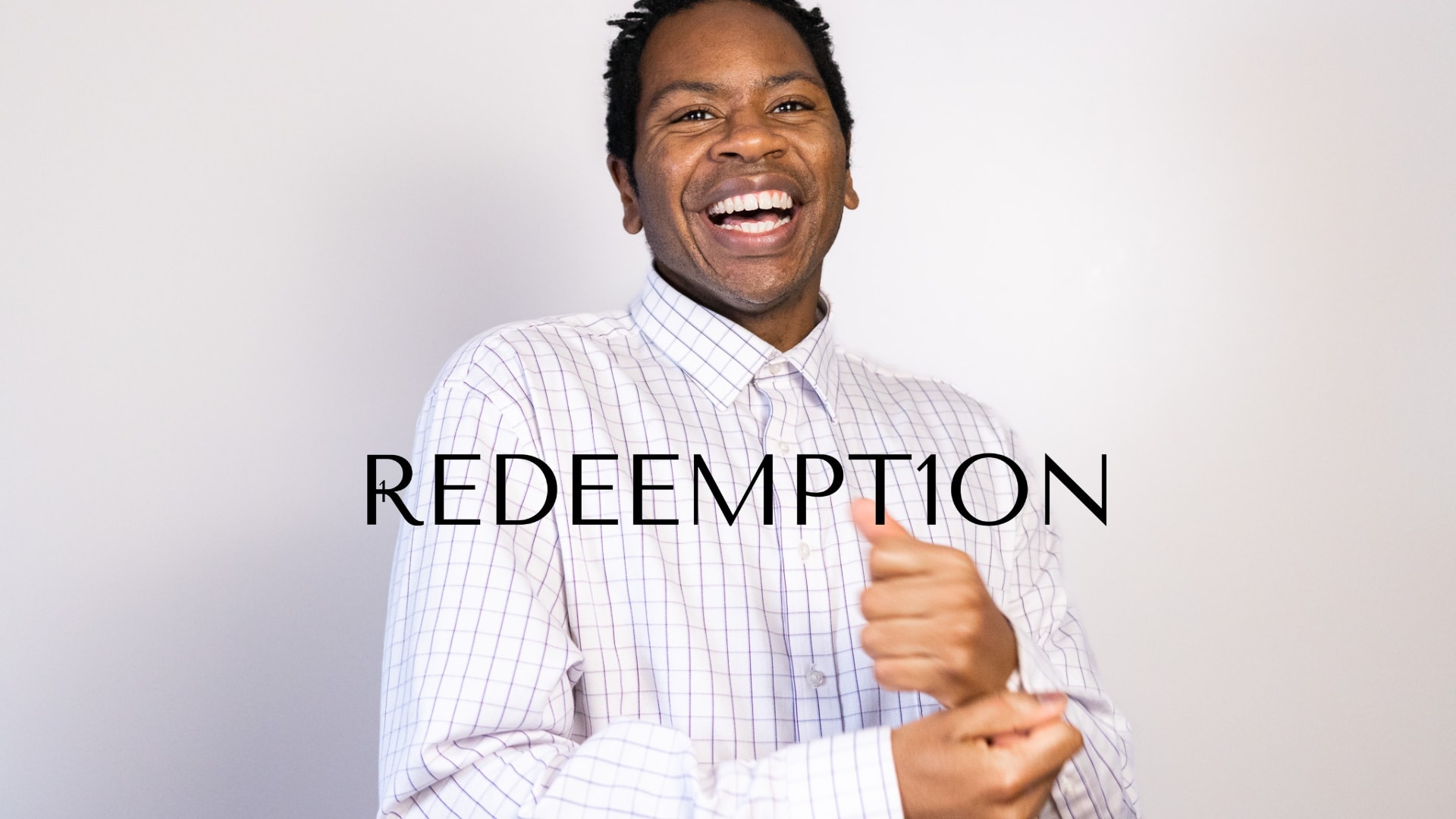 Richard Matthews laughing, with the Redeempt1on wordmark